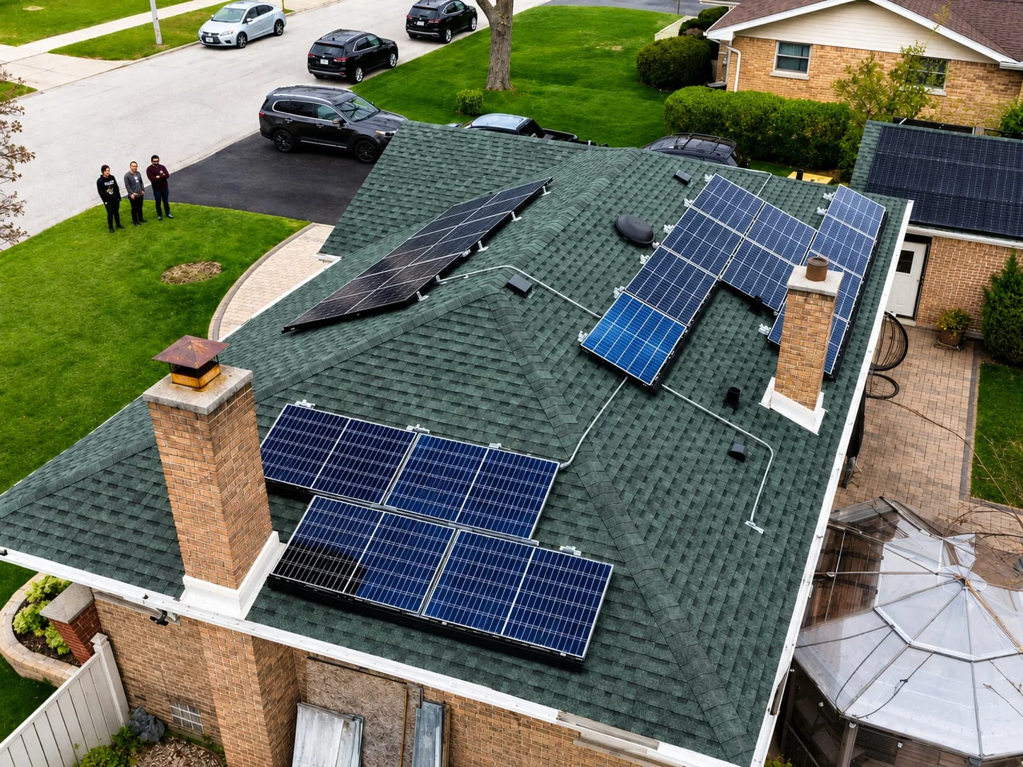 Home with a shingle roof and rooftop solar panels